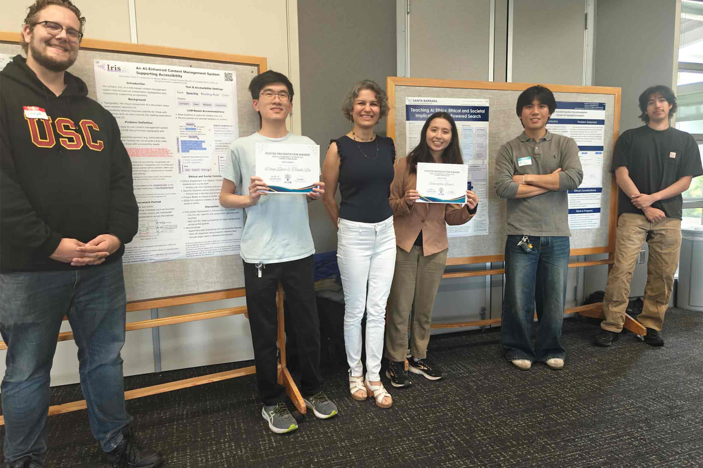 Maryam Majedi with students holding awards.