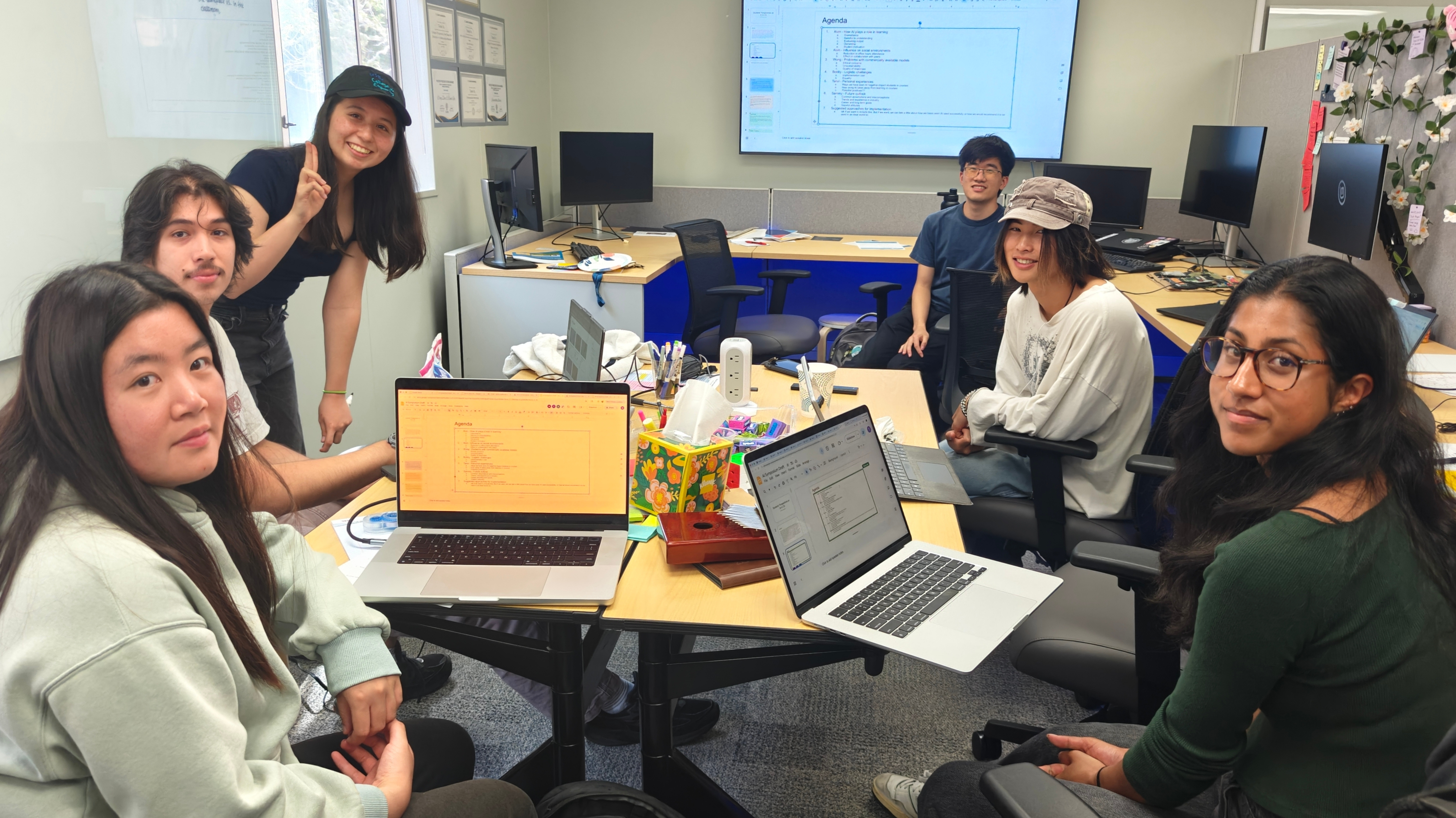 A group of Embedded Ethics lab Undergraduate Researchers (Left to right): Olivia He, Bobby Chavez, Sammy Lesner, Wong Zhao, Alvin Lee, and Tanvi Ladha, getting prepared for their talk for the AI CoP Symposium 2026